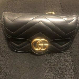 GG Marmont matelassé leather super mini bag.